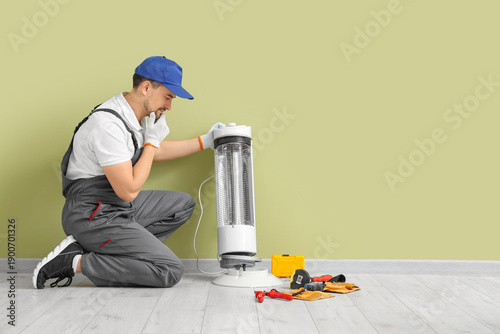 Thoughtful male technician ...