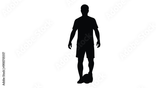 Silhouette of a man standing with a soccer ball on a white background