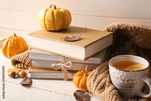 Stack of books, cup of tea,...