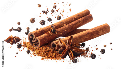 Close-up of cinnamon sticks, star anise, peppercorns, and spice powder on a black background © Blen