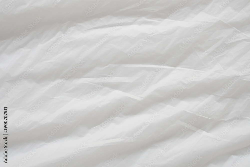 Obraz premium Crumpled White Plastic Sheet Surface Texture Background