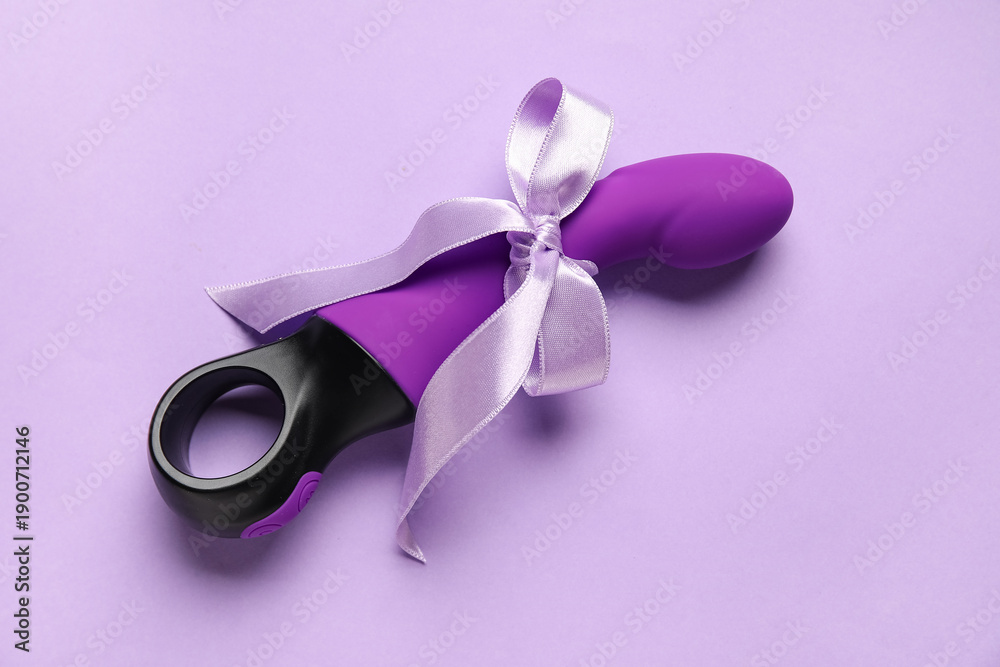 Obraz premium Vaginal sex toy as gift on lilac background
