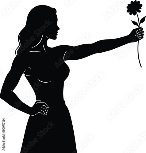 Silhouette of a woman holding a flower