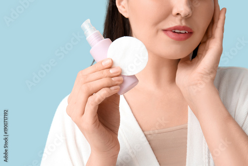 Young woman in bathrobe wit...