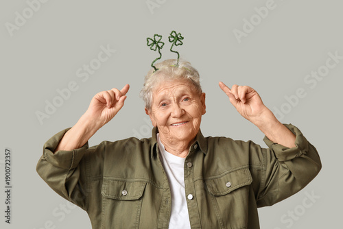 Senior woman pointing at he...