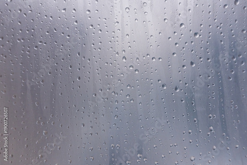 Fotografie Close-up of condensation droplets on a fogged plastic film