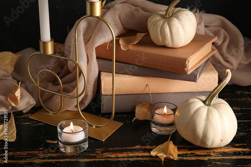 Burning candles, scarf, pum...