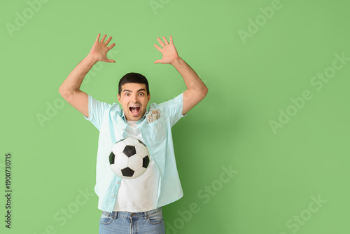 Happy young man with soccer...
