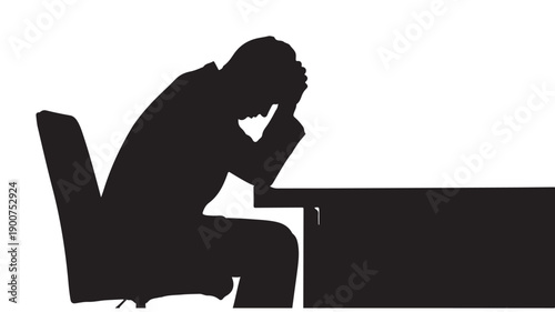 Man sitting at desk with head in hands, stressed or frustrated.