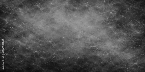 A dark grunge black and white texture features a storm of smoke and clouds moving through a night sky with fog and motion patterns