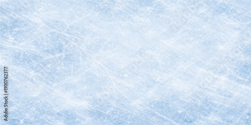 Abstract winter background featuring a blue grunge texture with white frozen snowflakes and crystal frost patterns on a bright cold surface for Christmas