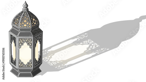 An ornate gray metal lantern with intricate designs casting a long shadow on a surface