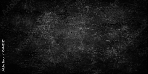 A dark and grungy vintage concrete wall background with a rough aged stone texture and a blank black paper surface for a dirty industrial backdrop