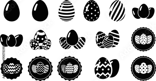 Black and white Easter eggs and decorated eggs on white background
