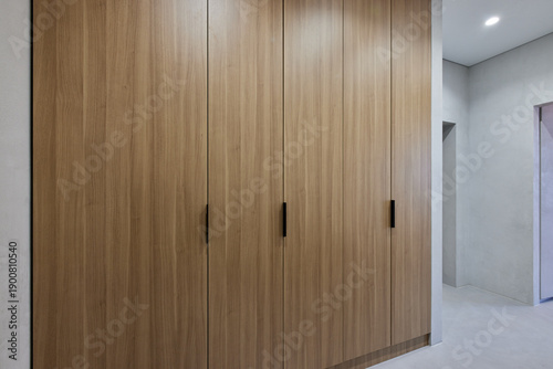 modern wooden cabinet in a hotel room