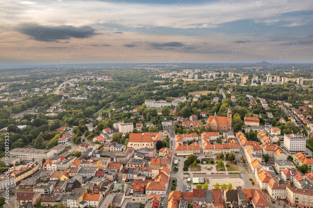 Obraz premium Aerial Drone Panorama of Historic European Town at Dusk with Red Roofs