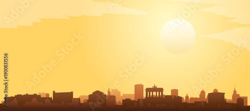 Golden yellow panoramic poster of the city skyline with misty background buildings and clouds of BERLIN, GERMANY