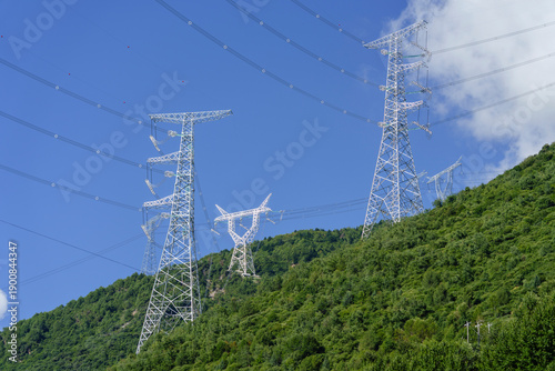 Принти на полотні Giant high-voltage power towers over a forest, Kangding, Garze Prefecture, Sichu
