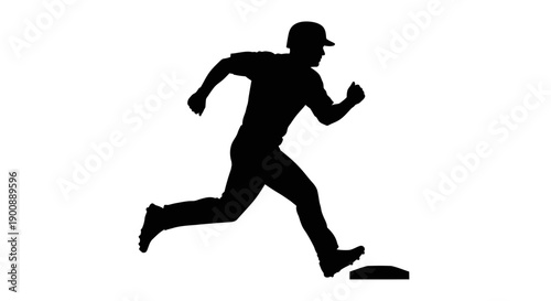 Silhouette of a baseball player in a running action, stepping off a base during a game.
