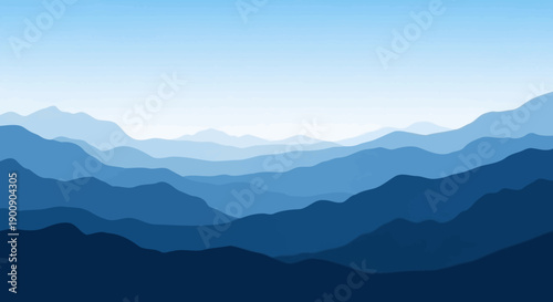 A serene landscape of layered blue mountains fading into a clear sky.
