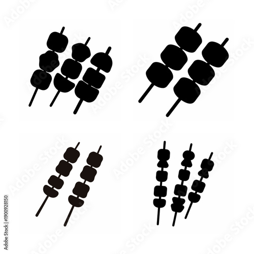 Four groups of black cylindrical objects with vertical lines arranged in different formations