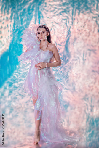High Fashion art portrait model woman in colorful bright neon lights posing, portrait of beautiful fantasy girl, trendy make-up and holographic tulle, colorful make up,  Vivid makeup