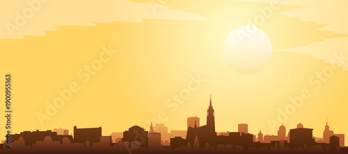 Golden yellow panoramic poster of the city skyline with misty background buildings and clouds of LODZ, POLAND