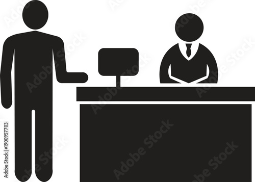 A man talking to a receptionist behind a desk