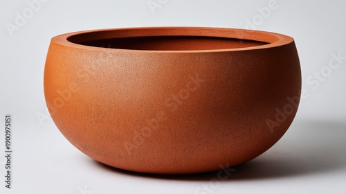 Simple stylish clay pot with smooth surface ideal for indoor or outdoor use