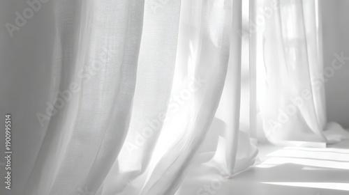 Soft white curtain fabric draped in natural light creating a serene atmosphere