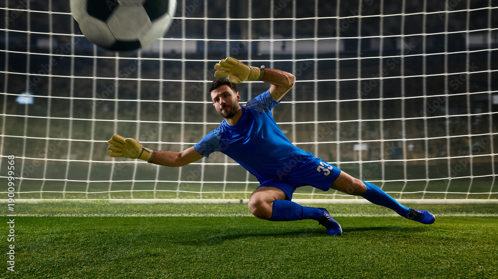 Fototapeta premium Soccer goalkeeper stopping close range shot during match play. Concept of one on one situation, scoring chance prevention, football analysis, coaching materials, sports advertising, and match coverage
