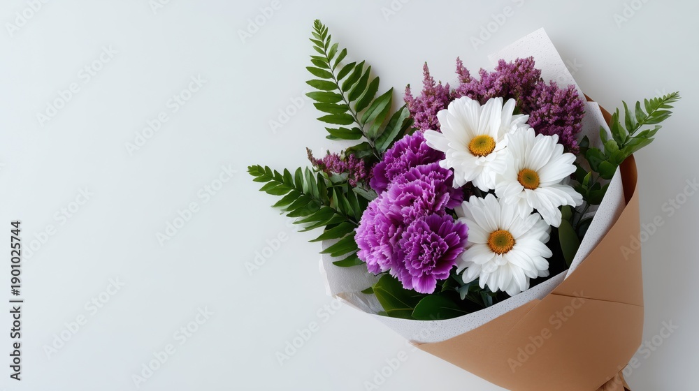 Naklejka premium Flower bouquet wrapped in paper on white background, elegant floral gift concept for Valentine’s Day, Women’s Day, Mother’s Day, greeting cards, and banners with copy space