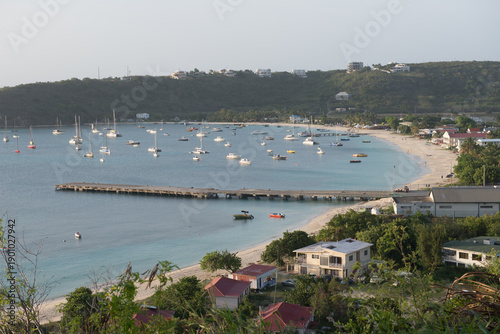 Bild auf Leinwand Tranquil Anguilla bay with sailboats and sandy beach under clear sky