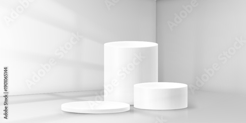 White podium set with soft shadows and minimal design. Clean 3d platform display with cylindrical stages on gray background. Modern product showcase with geometric pedestals and bright studio lighting