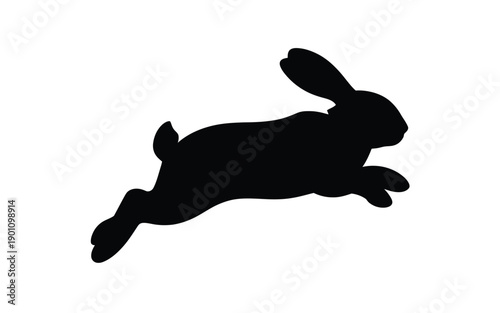Black silhouette of a running rabbit with ears up isolated on white background dynamic motion