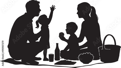 silhouette of family enjoying picnic in park