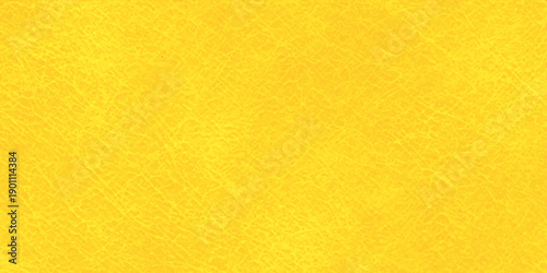 Vintage yellow paper and aged leather texture background featuring a grunge pattern on a blank weathered surface with gold and orange material tones