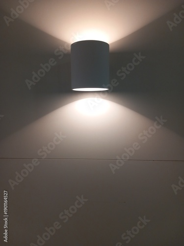 Fotografi Modern Wall Lamp with Soft Light on Minimal Interior Background
