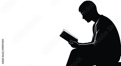 Silhouette of a young man intently reading a book, bathed in light against a stark white background.