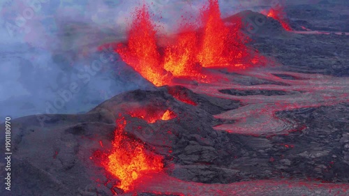 Aerial close-up of active volcano eruption with lava ountains in Iceland