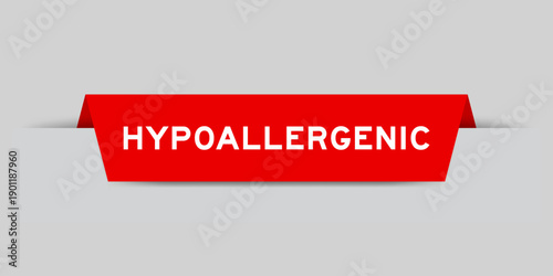 Red color inserted label with word hypoallergenic on gray background