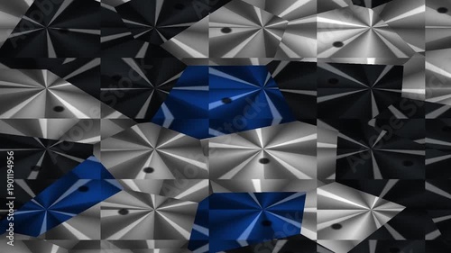 Abstract arrangement of metallic shapes in shades of blue, black, and silver