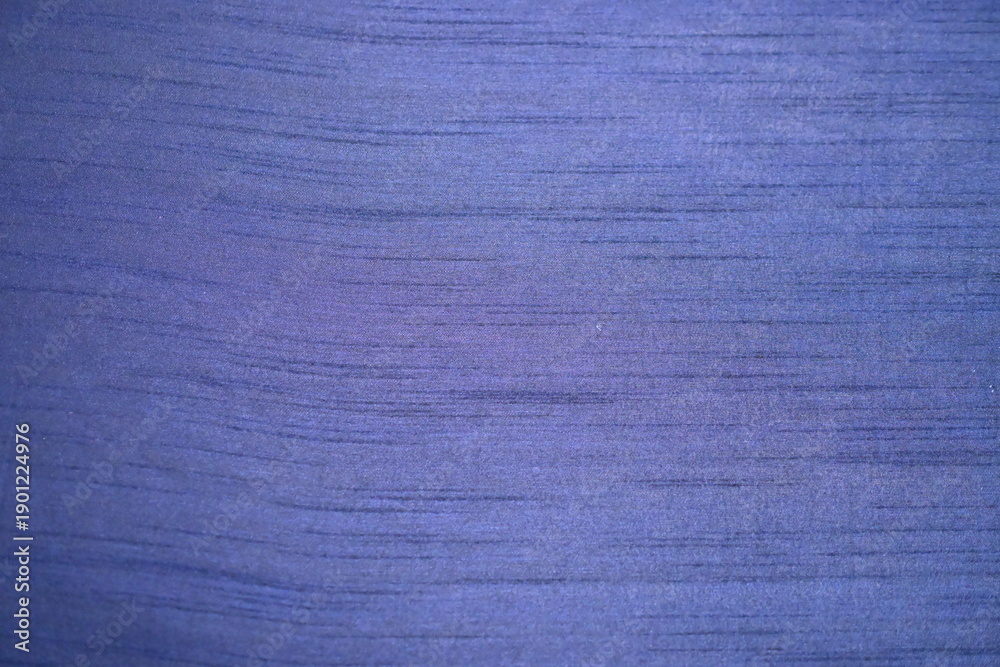 Fototapeta premium Vibrant blue textured fabric background with subtle horizontal lines