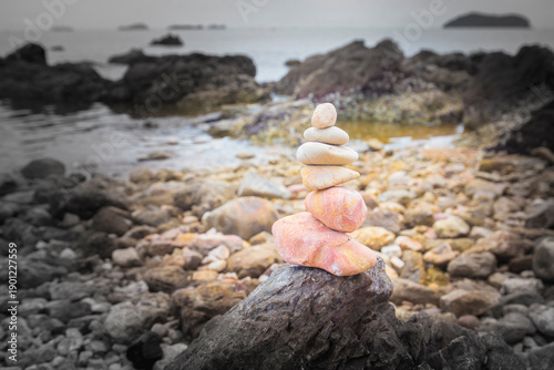 Photography Stacked stones on the seashore. Zen and harmony concept