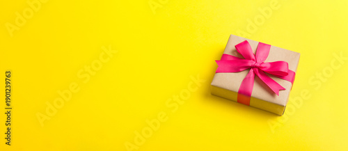 Wallpaper Mural Wrapped christmas or other holiday handmade present in craft paper with colored ribbon. Present box, decoration of gift on table, top view with copy space Torontodigital.ca