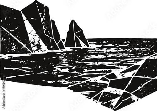 Black and white rocky coastline with sea waves, cliffs and jagged rocks by the shore