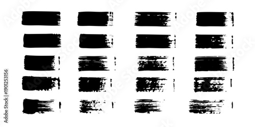 Arrangement of black brush strokes in a grid pattern on a white background