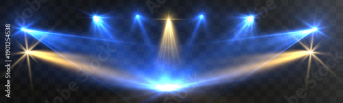 Bright blue and gold stage spotlights crossing on a dark background, creating a dramatic concert, theater or award show lighting scene with glowing beams and lens flares.