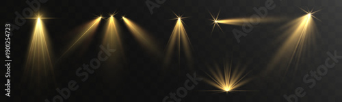 Golden stage spotlights casting soft glowing beams and lens flares on a dark transparent background, creating a dramatic theater, concert and award show lighting effect.
