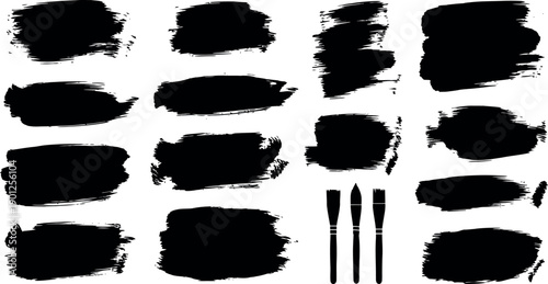 Set of bold black paint brush stroke shapes and artistic splashes with brushes on white